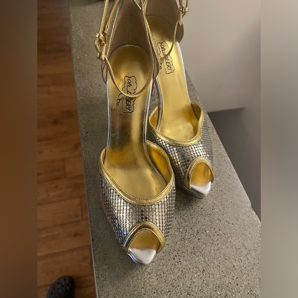 Oh Deer! Magical shoes. Metallic gold and silver. Red bottoms! Never worn.